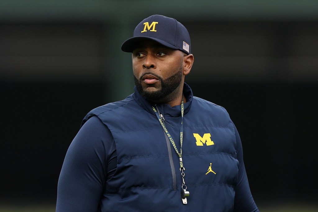 Former Michigan coach Moore detained by police after firing